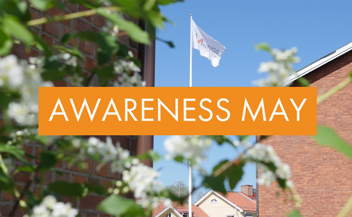 Bild med blommor och byggnader och texten Awareness May